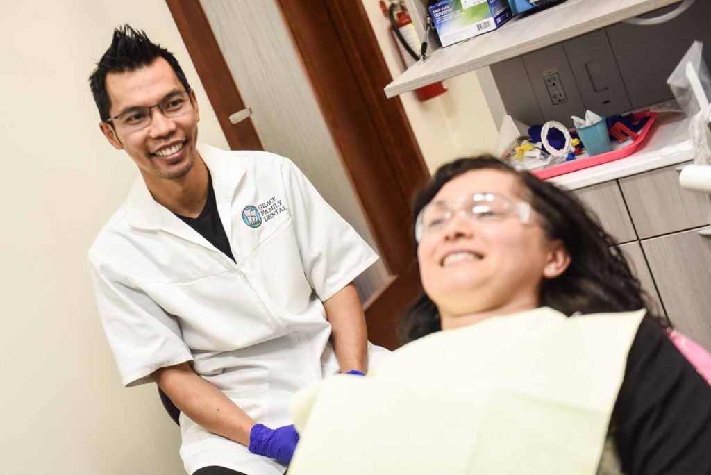 Dr. Quach and Smiling Patient | Grace Family Dental | Airdrie Dentist